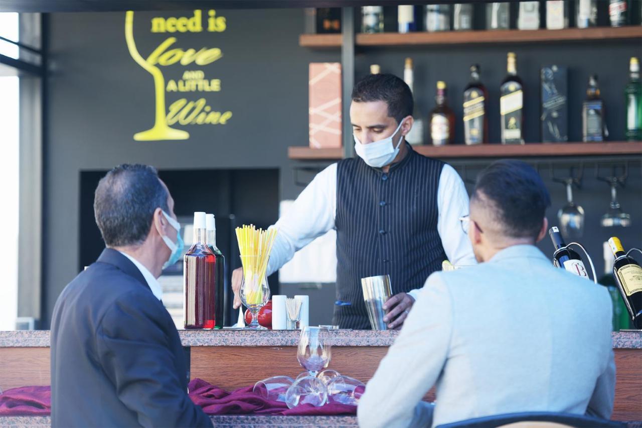 El Olivar Palace Marrakech El Harkat المظهر الخارجي الصورة A bartender wearing a face mask in Tirana, Albania