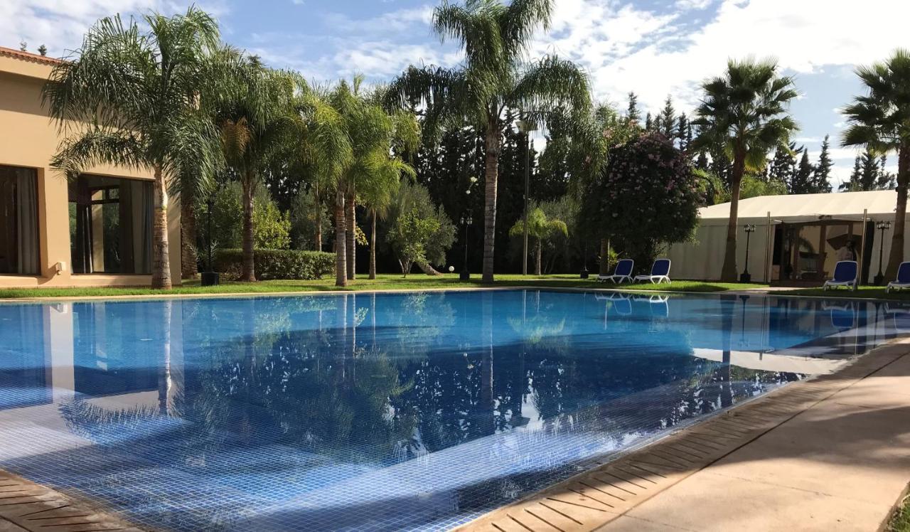 El Olivar Palace Marrakech El Harkat المظهر الخارجي الصورة The pool at the Royal Palm Hotel
